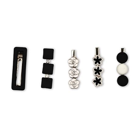 Shop a stylish set of 5 black, white and gold decorative hair clips featuring floral, bow and geometric designs. Trendy hair accessories for women and girls.