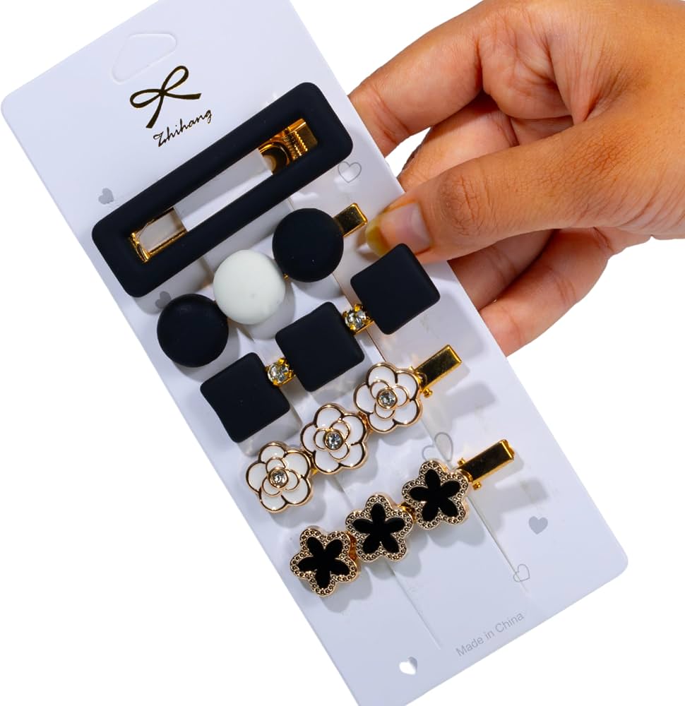 Shop a stylish set of 5 black, white and gold decorative hair clips featuring floral, bow and geometric designs. Trendy hair accessories for women and girls.