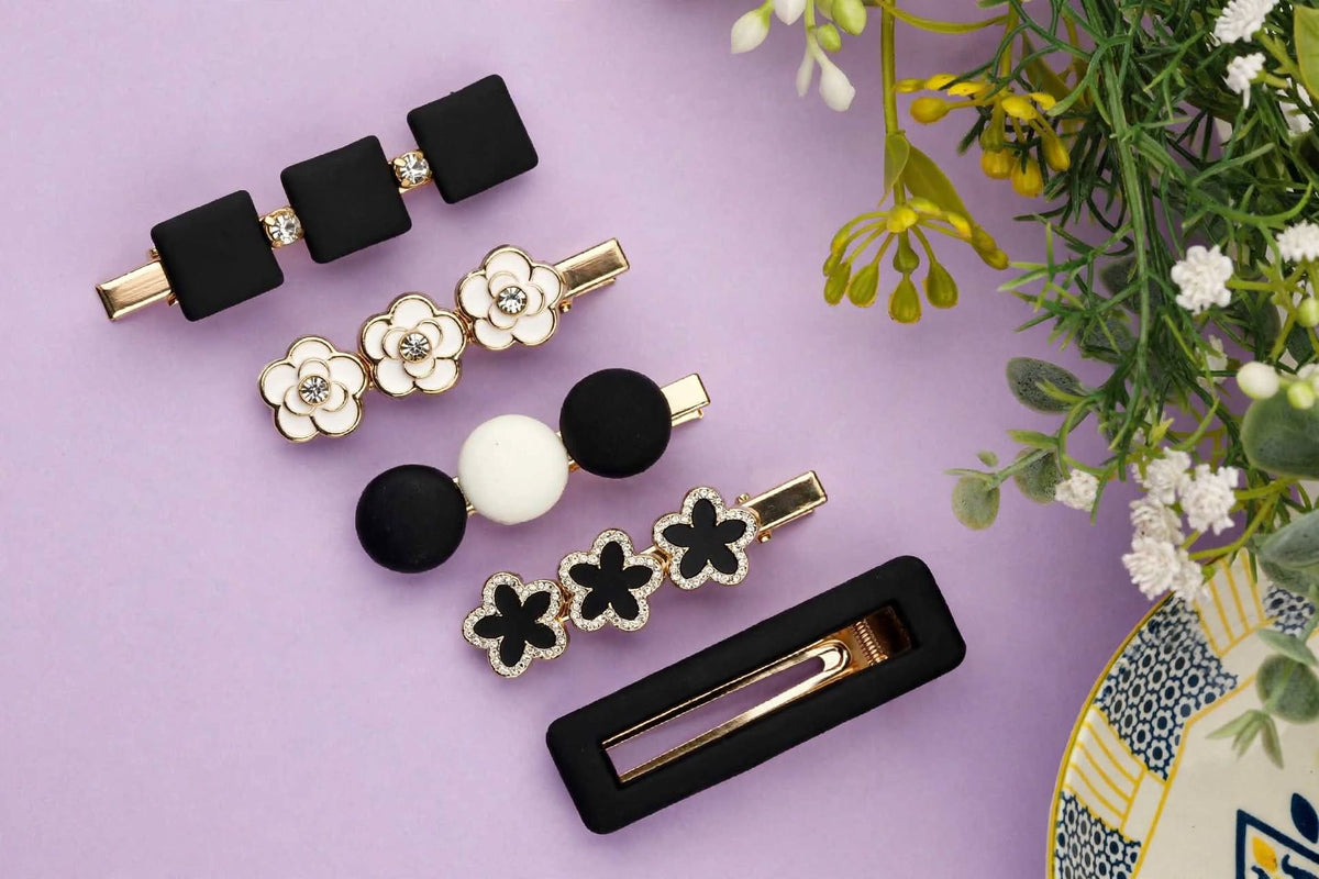 Shop a stylish set of 5 black, white and gold decorative hair clips featuring floral, bow and geometric designs. Trendy hair accessories for women and girls.