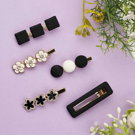 Shop a stylish set of 5 black, white and gold decorative hair clips featuring floral, bow and geometric designs. Trendy hair accessories for women and girls.