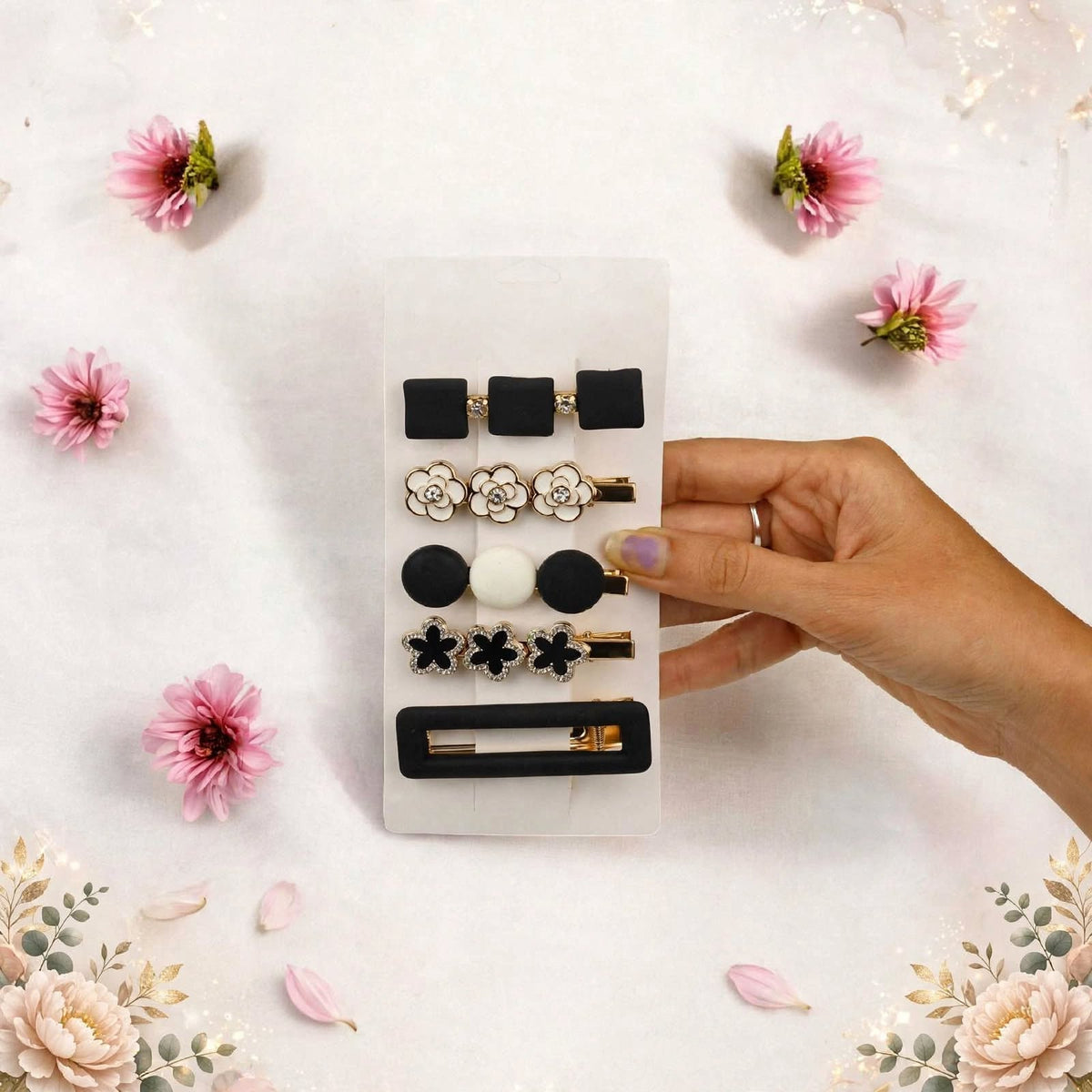 Shop a stylish set of 5 black, white and gold decorative hair clips featuring floral, bow and geometric designs. Trendy hair accessories for women and girls.
