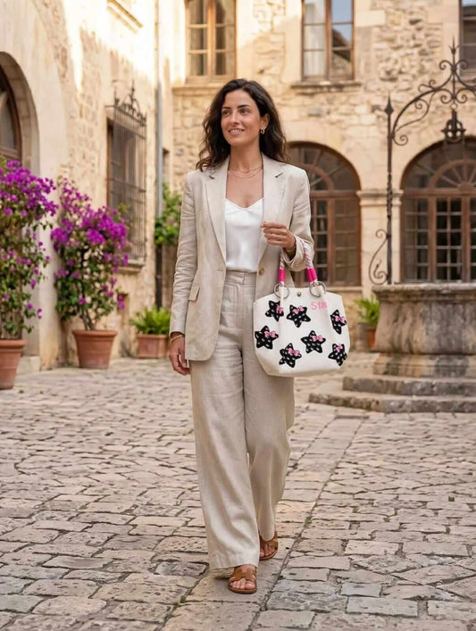 Women’s white printed tote handbag with black stars pink bows and rope handle